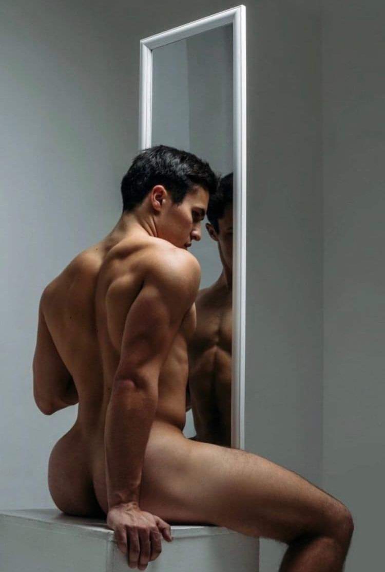 Man sat in front or a mirror